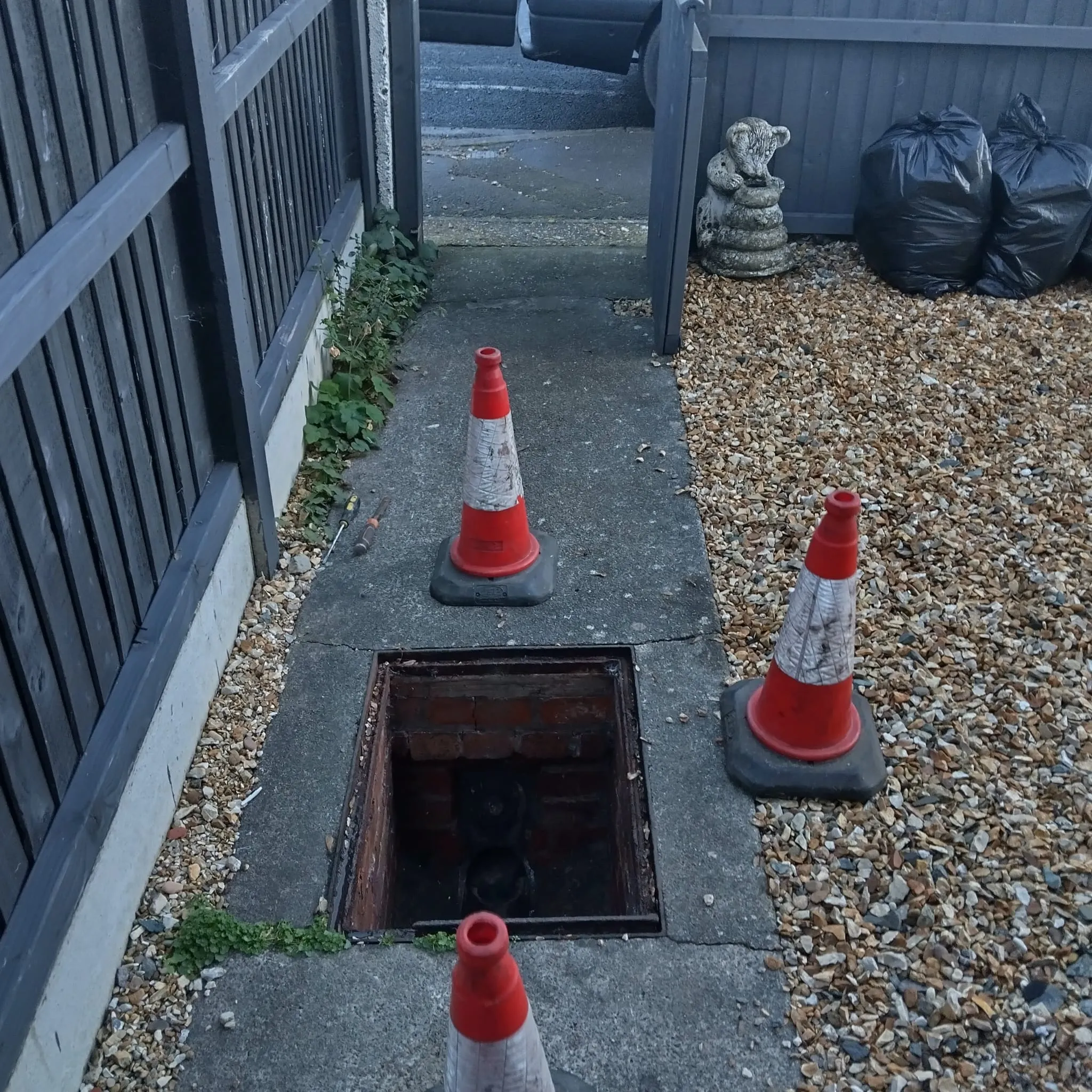 Open manhole drain cover — CCTV drain survey in Hull